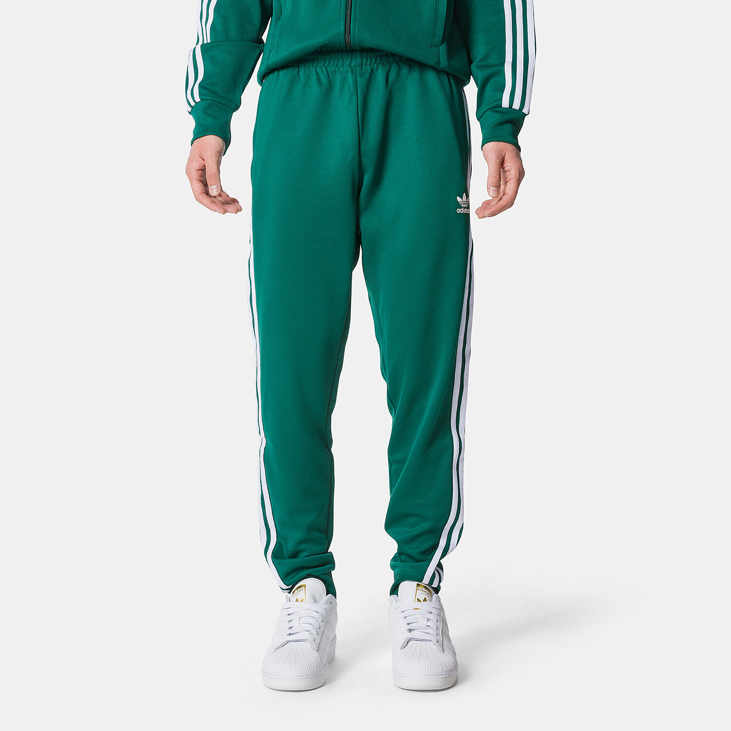 Green and white adidas track pants deals