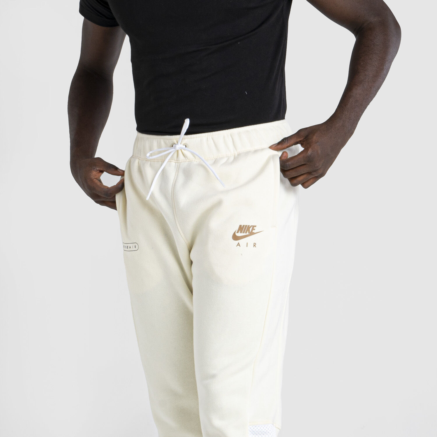 White and gold nike pants online