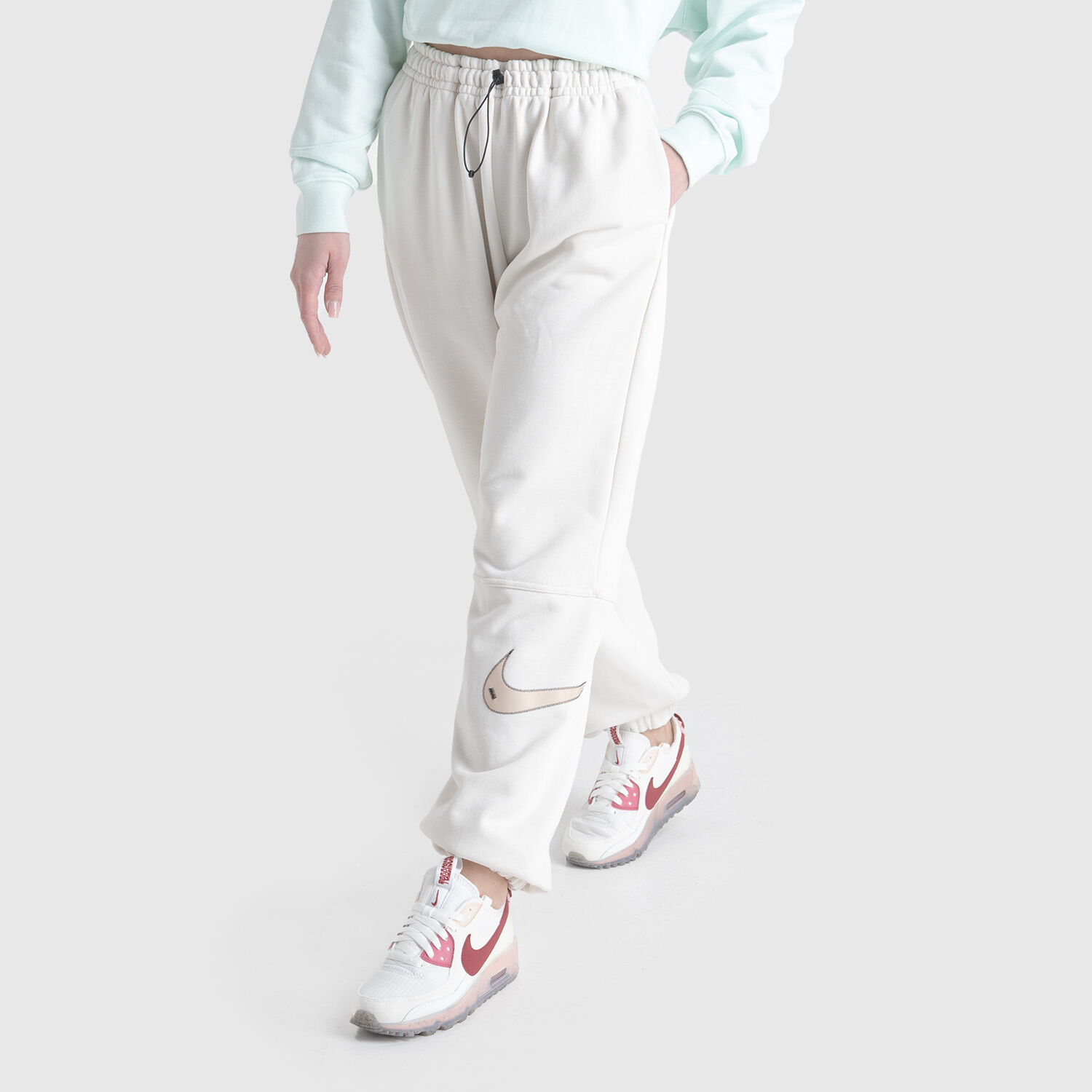 Nike swoosh hotsell pants womens